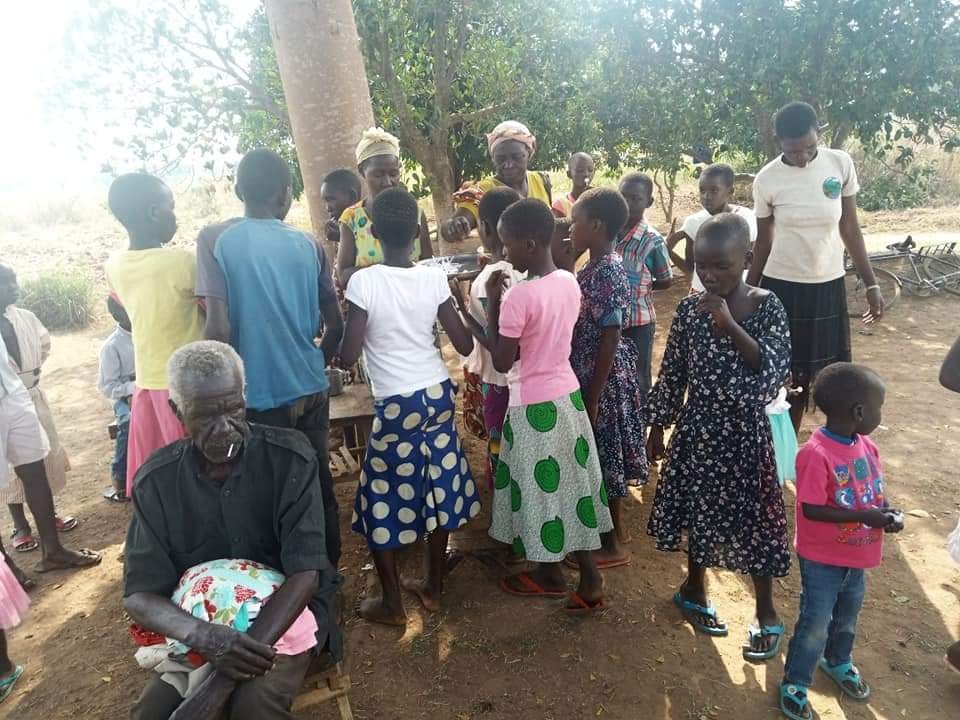 GIVING CLOTHES TO COMMUNITY.