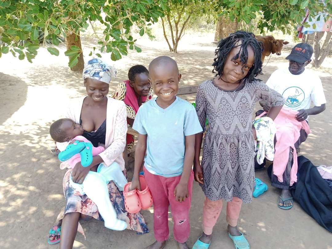 DOOR TO DOOR GIVING SHOES AND CLOTHES.
