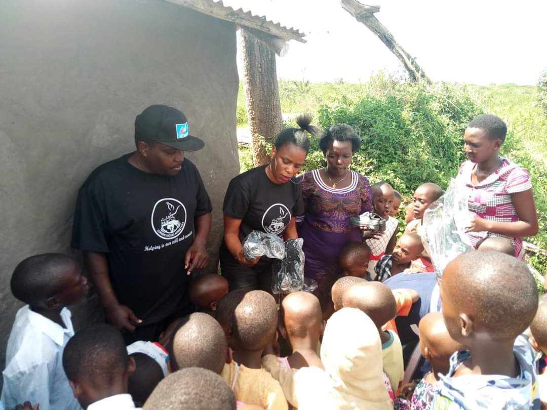 NAKASONGOLA GIVING OUT SHOES PROJECT .