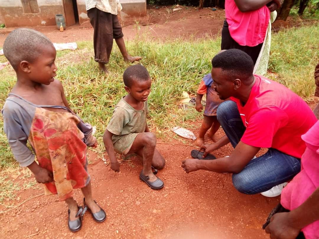CHILDREN SURPRISED WITH NEW SHOES.